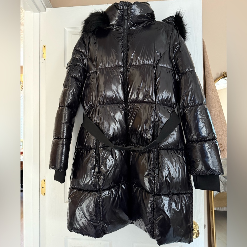 Glossy black DKNY Puffer Coat with detachable hood, hand warmers and belt.